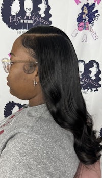 the back of a black woman with long hair